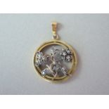 An Edwardian diamond set pendant, in the form of an openwork floral sprig set with old-cut diamond