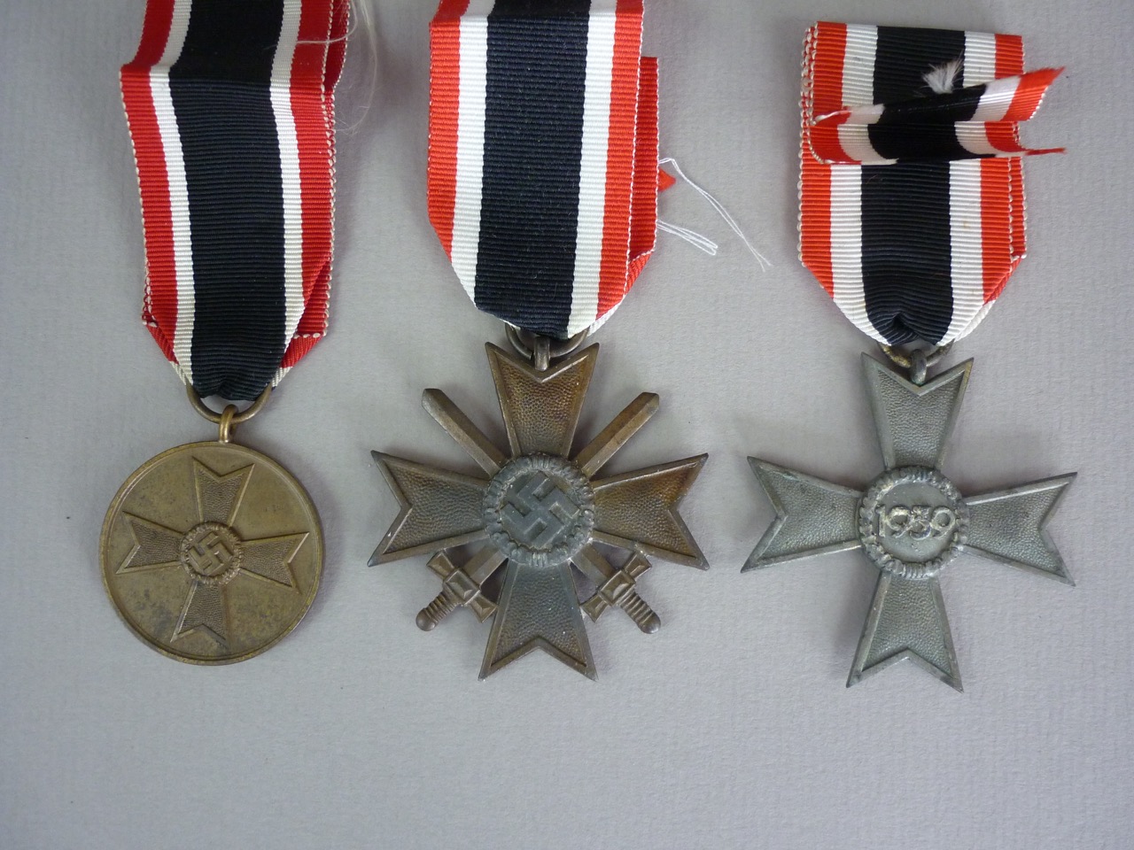 Two German Third Reich War Merit Crosses and a War Merit Medal