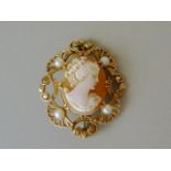 A shell cameo brooch, carved with the profile portrait of a young girl, crown set above a