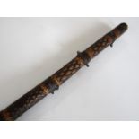 A rustic walking cane carved in a banded diaper pattern, 92 cm