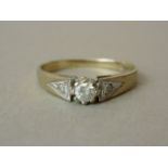 A diamond solitaire, the brilliant of approximately .10ct, crown and cathedral set with illusion set