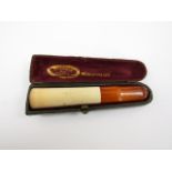 A late 19th Century meerschaum and amber cigar holder by J Sommer, Paris, cased, 10.5 cm