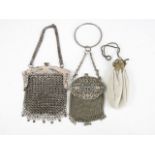 Three early 20th Century and later electroplate evening bags, one with bracelet suspender and