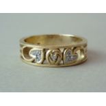 A contemporary Charles Rennie Mackintosh style diamond ring, the openwork band having a central