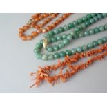 Three vintage semi-precious necklaces, including a single strand of graded branch coral, a strand of