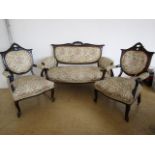 A late 19th Century French influenced upholstered and ebonised salon suite