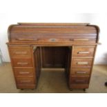 A late 19th / early 20th Century oak roll-top desk, 122 cm x 106 cm high