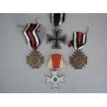 An Imperial German second class Iron Cross, two German Third Reich Honour Crosses and a Great War