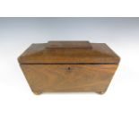 A late Georgian rosewood sarcophagus form tea caddy, the interior fitted for and containing two