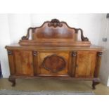 A fine large late 19th / early 20th Century walnut veneered chiffonier, having a shouldered back