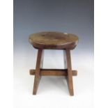 An early 20th Century Arts and Crafts hardwood stool, 36 cm