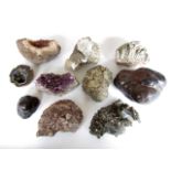 A collection of large rock and mineral specimens including amethyst, haematite, quartz crystals,