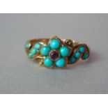 An early Victorian turquoise and almandine garnet mourning ring, the stones rub-set in a central