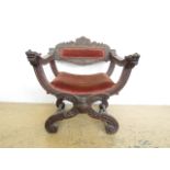 A 19th Century Venetian style carved walnut X-frame armchair