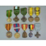 A quantity of French and Belgian military medals and insignia