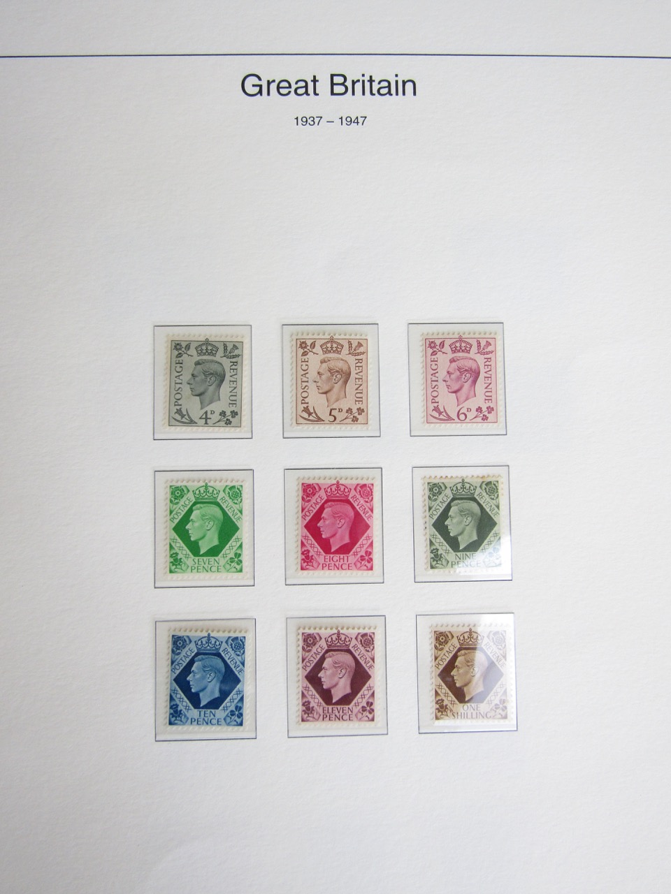 GB stamps, contained within two maroon The Great Britain Collection binders, including British