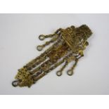A Victorian gilt metal chatelaine, with reticulated waist belt plaque in the form of a figural