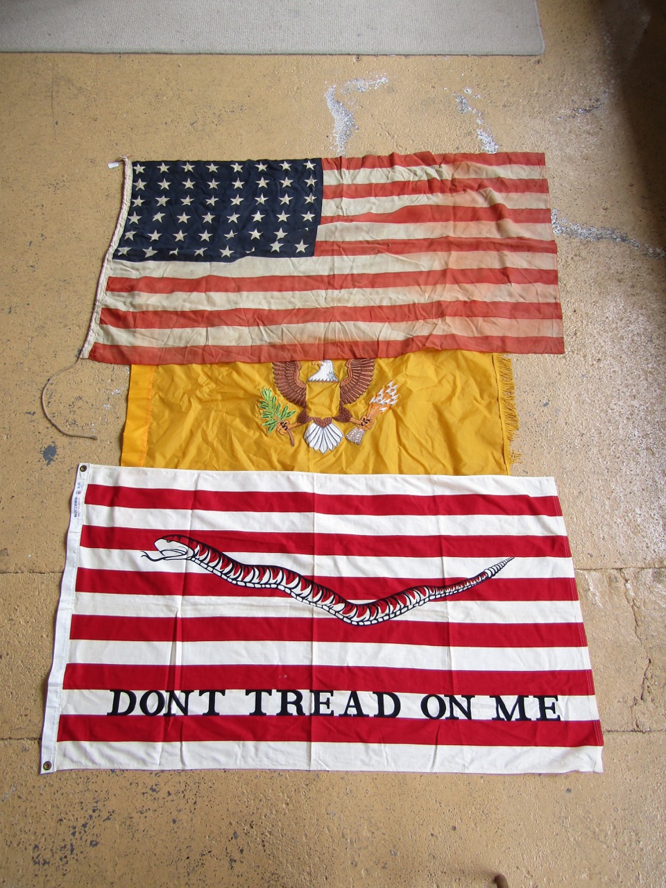 A US Army eight star printed cotton flag together with two other flags
