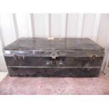 A black enamelled tin trunk