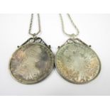 Two reproduction 1780 Maria Theresa silver thaler coins mounted as pendants, on sterling silver