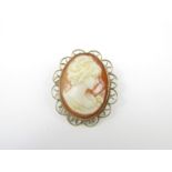 A mid 20th Century shell cameo brooch, carved in depiction of a young lady, bezel set in a 9ct