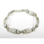 A Charles Rennie Mackintosh style silver bracelet, set with blue stones, 19 cm, 16.6g