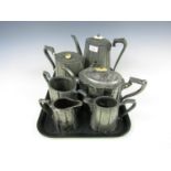 Six pieces of electroplate including two teapots, a water jug, two creamers and a sugar basin