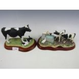 A Border Fine Arts figurine Holstein Fresian Cow and New Calf, together with two calves drinking