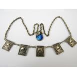 A silver necklace with longboat decorated plaques