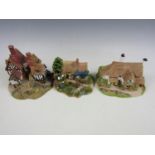 Three Lilliput Lane ornaments including Portwinkle cottage, Ship Inn and Summer Days