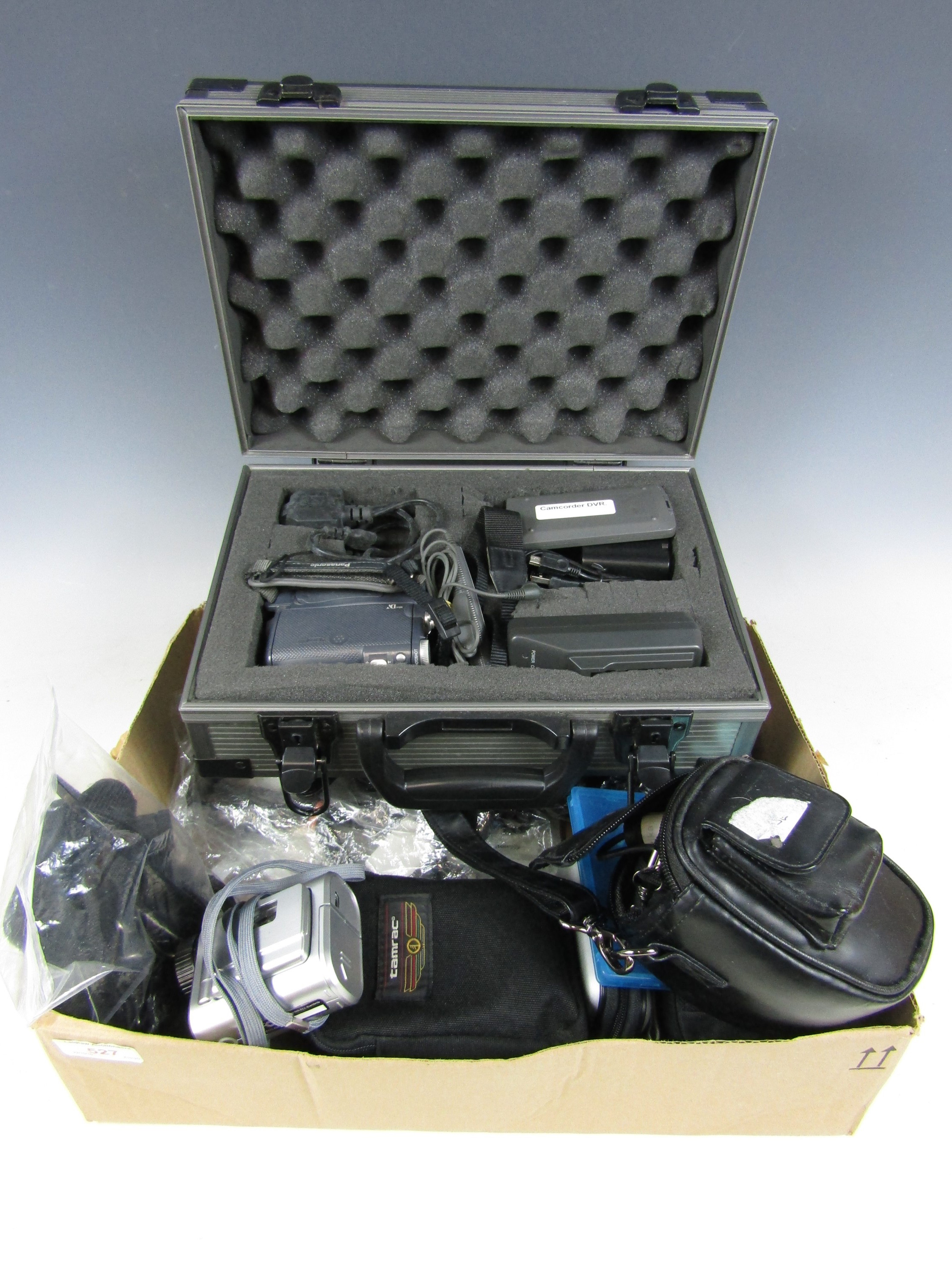 A cased Panasonic NV-GS11EB video camera together with a Canon Powershot A80 etc