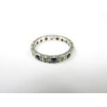 A 9ct white gold eternity ring, set with blue and white stones