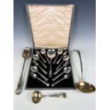 An electroplate basting spoon together with two ladles and a cased dessert set