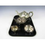 A three-piece 1930's electroplate tea set together with another teapot