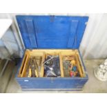 A blue painted pine tool chest with tools