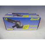 A boxed Power Craft angle grinder