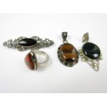 Silver and hardstone jewellery, including a bar brooch, contemporary ring, and two pendants