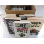 A box of military books including Forgotten Voices of the War