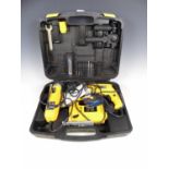 Cased Einhall power tools including a drill, a grinder and a jigsaw