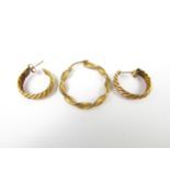 A pair of yellow metal hoop earrings, together with one other scrap gold earring, 1.8g