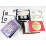 A large quantity of commemorative issue first day cover coin sets, including John Pinches' Day of