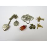 A quantity of jewellery including an agate fob, silver locket with chain, gold chains (a/f),