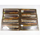 Eight boxed Mainline railway carriages