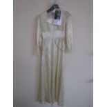 A 1940's John Selby wedding dress, in champagne satin with applied paint spots forming a scrolling