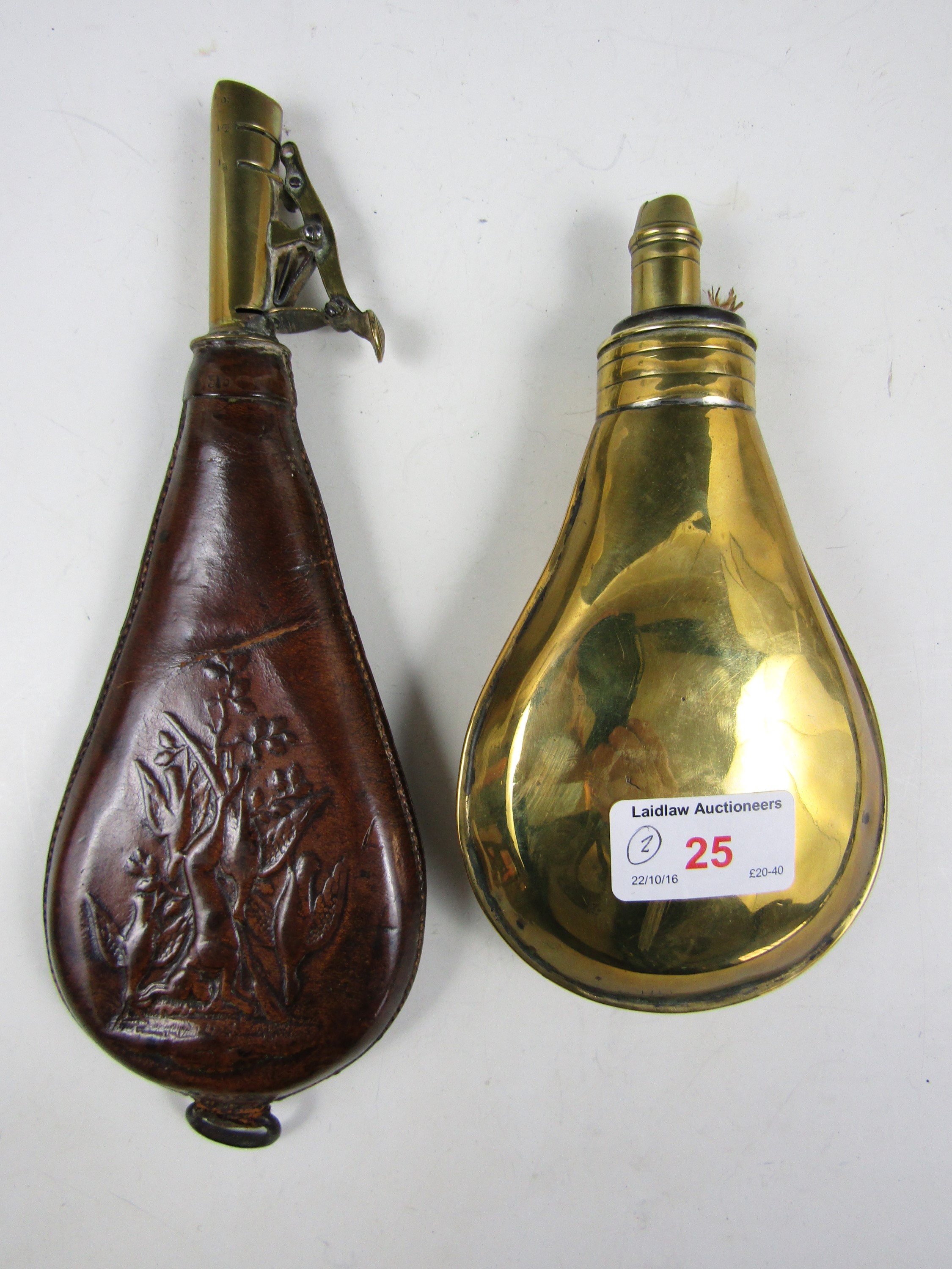 A 19th Century brass powder flask by Dixon, together with a hide shot flask