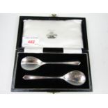 A cased pair of silver preserve spoons, Barker Brothers of Birmingham, 1952