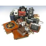 A quantity of cameras including an Ensign E28, Portrait Hawkeye No2, two Brownie No2 cameras,