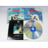 A Star Wars video disc together with an Airplane video disc and Raise the Titanic video disc