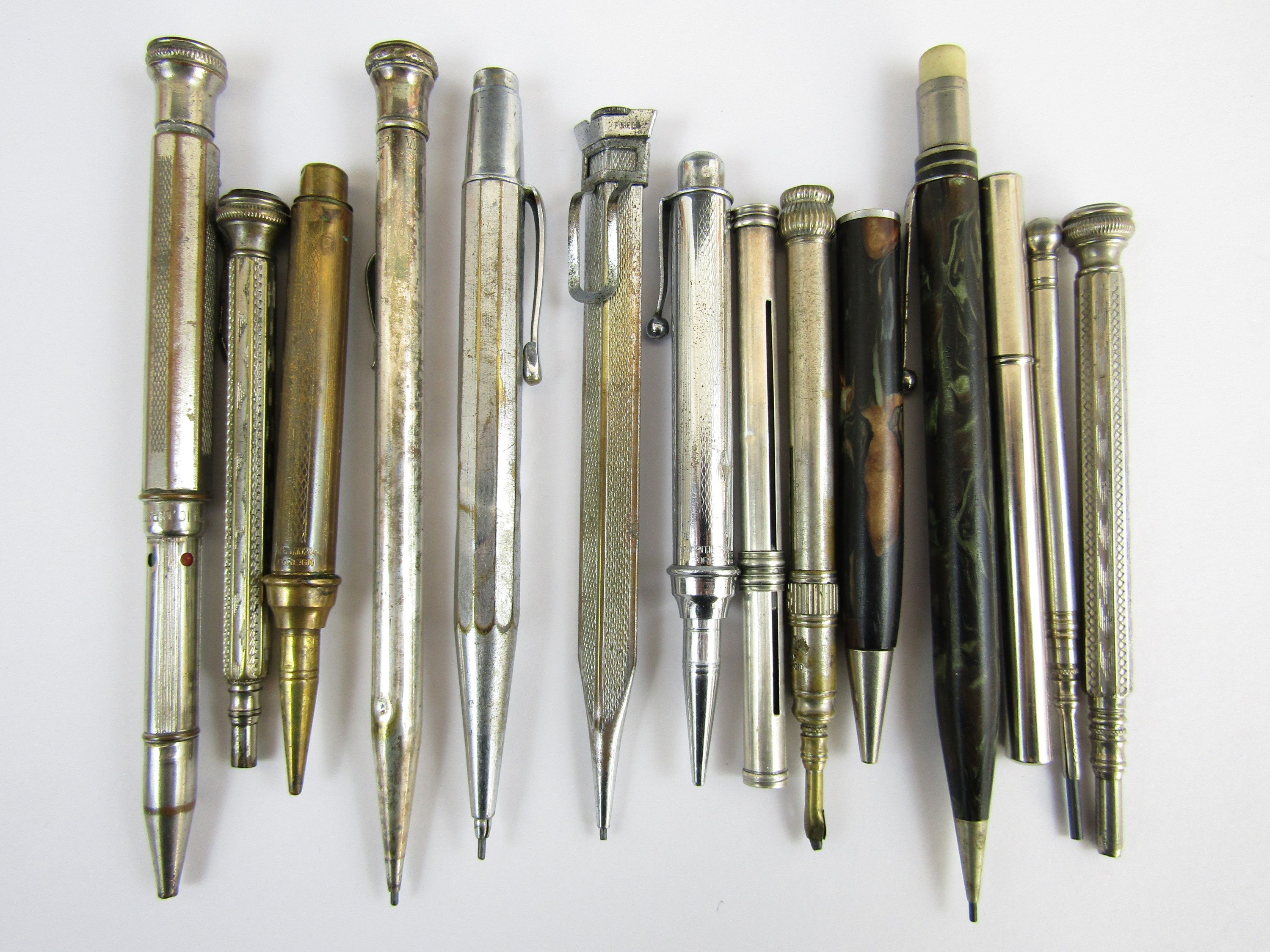 Fourteen vintage base-metal and celluloid propelling pencils
