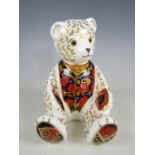 A Royal Crown Derby Collectors' Guild bone china 'Debonair Bear' paperweight, with gold stopper,